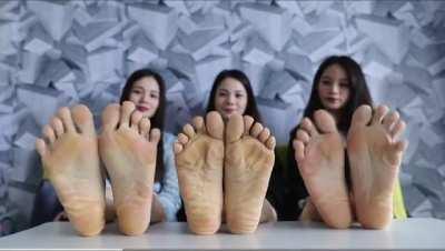 Asian trio spreading their toes