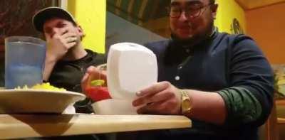 Attempting to put a margarita into a to-go box