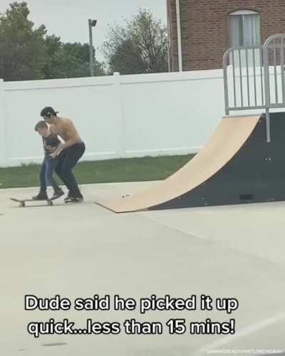 Big skater dude teaches little skater dude