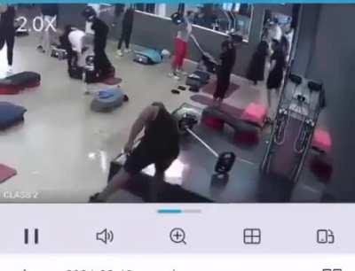 Guy casually enters a gym and sets it on fire