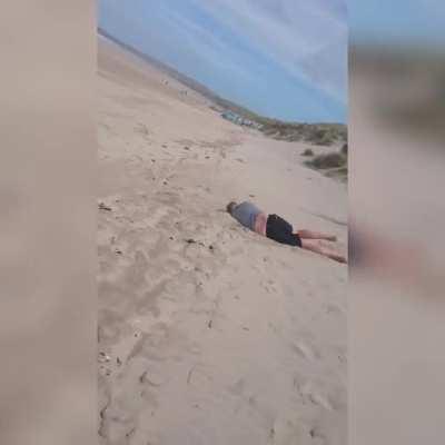 Wife Laughs As Guy Gets a Face Full While Sandboarding