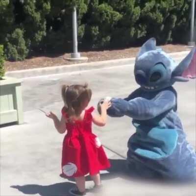 Little girl falls so Stitch does too to make her feel better.