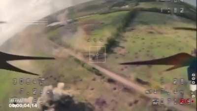 Abrams tank with cage hit with drone