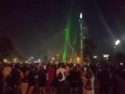 Protestors take down police drone using lasers