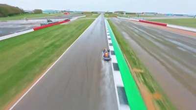 Following an F1 car around a lap with a video drone