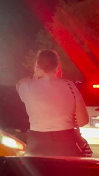 This lady stood in front of my girlfriend car preventing us from leaving the concert so her family could go first. We had planned to let them go ahead of us but she decided to do this.