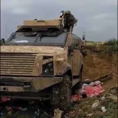 Azerbaijani soldier shooting mortar round from military vehicle during the Karabakh war