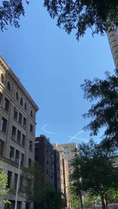 Some weird skywriting going on over midtown.