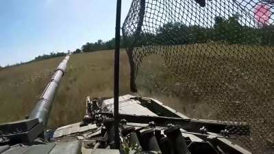 Tank from the 14th &quot;Chervona Kalina&quot; Brigade of the National Guard of Ukraine firing at Russian positions, while under fire. Pokrovsky direction. Music from source