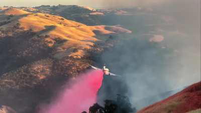 DC-10 Dropping On Creek,CA Fire