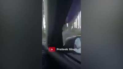 Car is driving at more than 110km/hr on a narrow road. Loses control at a left turn and crashes into a tree. Right side of the car completely caves in. No mention of driver. In the full video, the driver can be seen endangering the lives of other motorist