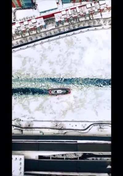 Ice breaker boat going through Chicago River