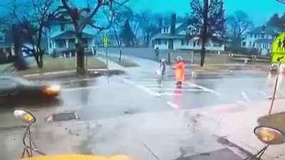 Brave crossing guard throws child out of the way and takes a nasty hit after car fails to stop