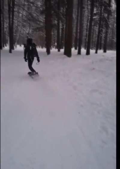 This guy snowboards uphill