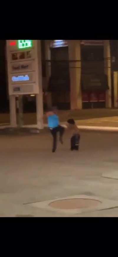 Midget picks fight with tall woman