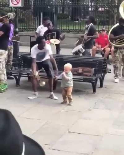 This guy is jamming his heart out with street musicians