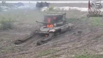 Footage of a Ukrainian drone operator dropping an American M67 grenade through the open driver's hatch into a Russian tank. 