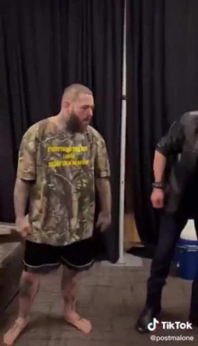 Post Malone and Triple h doing the water spit