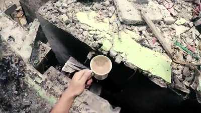 A Philippine SOC fighter carries coffee to his commander during the battle for the city of Marawi against an ISIS group. Video from 2017.