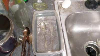 Cleaning silver with household items: hot water, baking soda, salt, and aluminum foil