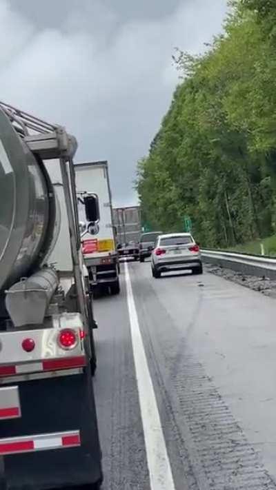 Idiots overtaking on the emergency lane get blocked by trucker