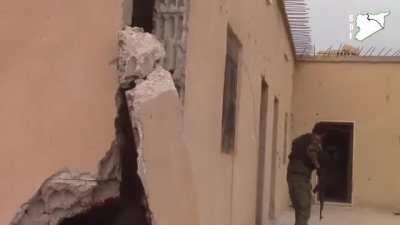 Close house combat fighting between Kurdish fighters and ISIS militants. ISIS militant blow himself up to not fall under captive