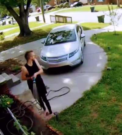 Dude just watering his plants. nothing to see here.