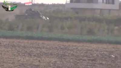 Early-War FSA fighters target an SAA tank with a mistimed two stage IED attack - 9/29/2012