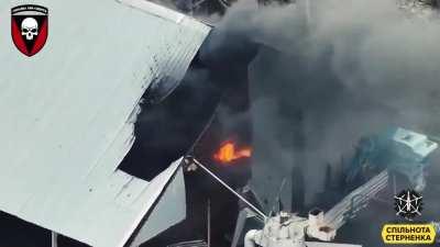 72 Mech Brigade &quot;Black Zaporozhians&quot; destroy a Russian BMP in a hangar. Great maneuver skill by drone pilot