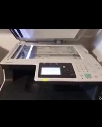 Pouring water on a copy machine