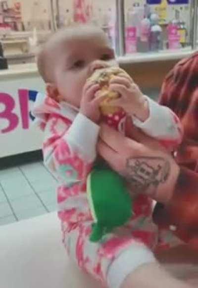 Babies first taste of ice cream.