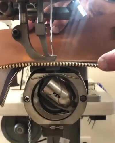 A slow motion look at an industrial sewing machine