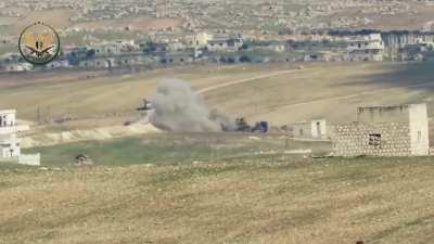 NLF ATGM strike on a Syrian Army tank on its transport truck - Armanaya, Idlib