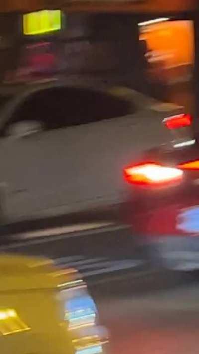 Man jumps on car....Right next to the police