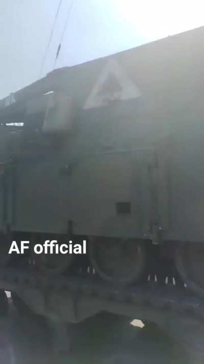 A US-supplied M88 armored recovery vehicle of the Ukrainian army with triangle marking, on a transport trailer.