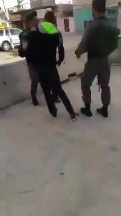 Israeli soldiers detain a 2 year old Palestinian child