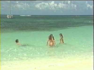 Parafotos - Treasured Island (UK1993) - Treasure hunters going for a dip at Club Orient beach