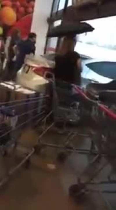 Woman parks car inside the grocery store