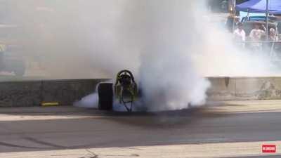 Dragster driver passes out due to heat exhaustion and ends up doing gnarly burnout.