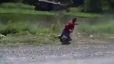 Guy fights a monkey for sitting on his motorcycle