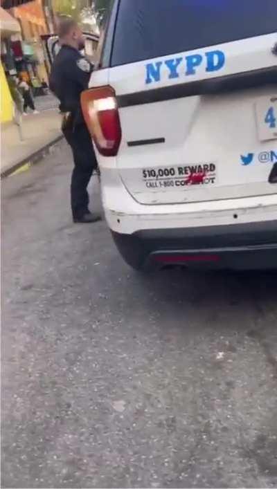 Woman rips into a couple of NYC officers blocking the whole road for a non-emergency stop