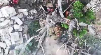 Russian soldier gets hit in a head by a drone dropped grenade.