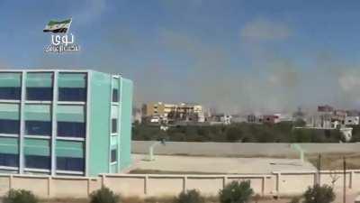 Opposition camera captures the moment an SAA MLRS attack lands on the city of Daraa - 5/16/2014