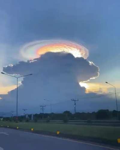 I'm no Meteorologist, but this appears to be a Cumulonimbus Cloud crowned by a Lenticular Cloud.