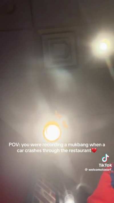 Woman records Mukbang just as car crashes into restaurant