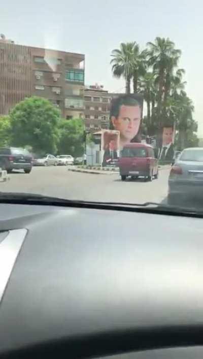 A tour in Damascus: imagine how much each of these colored posters cost for an election whose results are already known in a country going through acute economic devastation