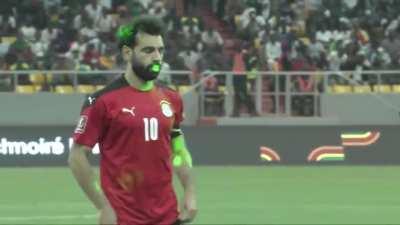 Mo Salah taking a penalty for Egypt with laser pointers in his eyes earlier today