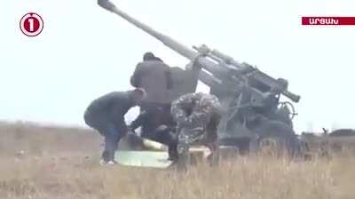 Armenian civilians helping to fire Artillery on Azerbaijani positions.