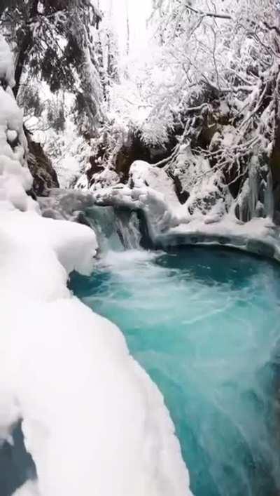 Alaska in Beautiful Mountains With A Waterfall