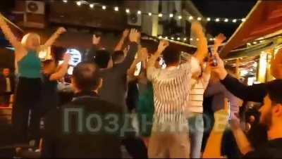 Russians dancing to pro-putin son in center of Tbilisi. 